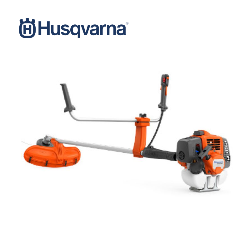 Husqvarna 541RS Brushcutter in action, showcasing its powerful engine and cutting capabilities.